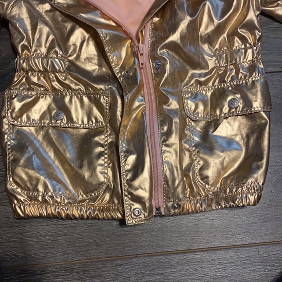 A gold Cat & Jack rain jacket. - Picture 3 of 4
